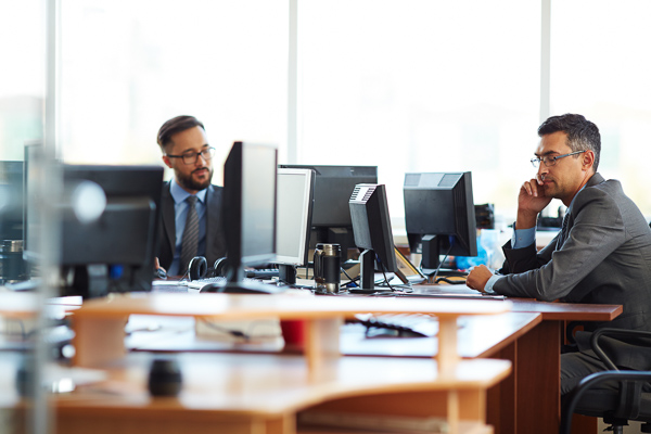 Male colleagues working in office